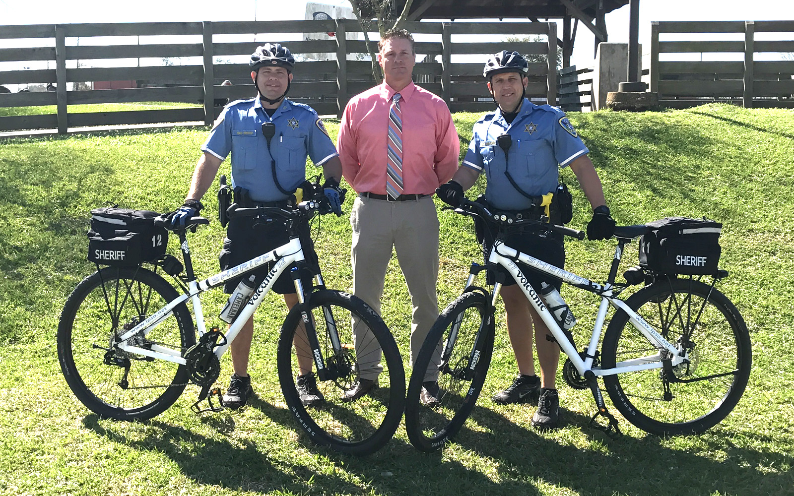 Sergeant Todd Prevost (left) and Deputy Jason Matherne (right) pictured with John Champagne (center) of the Community Crusaders of Lafourche.