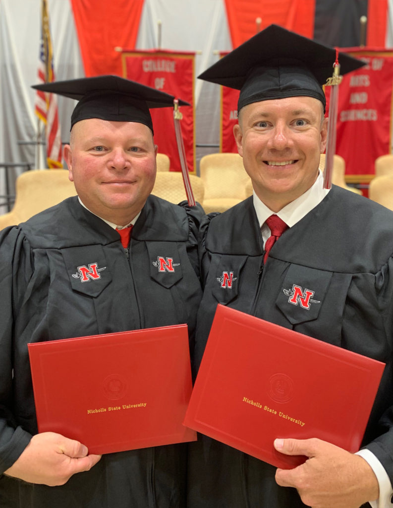 Captain Lafate Day (left) and Lieutenant Michael Beck Jr. (right) graduated with degrees in Criminal Justice on Saturday at Nicholls State University. 