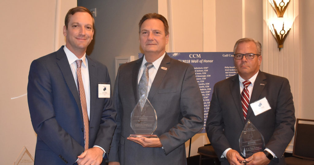 Jason Reibert (left), Chapter President of the Construction Management Association of America, presents awards to Sheriff Craig Webre (center) and Jim Brown (right), Director of Preconstruction Services at W.G. Yates & Sons Construction Company. 