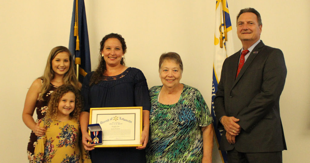 Captain Jessica Bordelon is pictured with her family and Sheriff Webre. She is the 2019 recipient of the Sheriff's Star. 