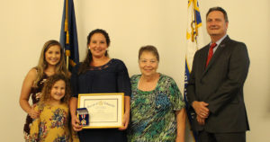 Captain Jessica Bordelon is pictured with her family and Sheriff Webre. She is the 2019 recipient of the Sheriff's Star.
