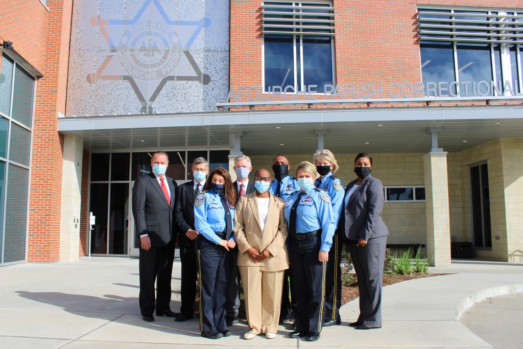 Lafourche Parish Correctional Complex - Front Row L to R: Lt. Carla Landry, Robbin Bell (ACA), Captain Karla Beck. Back Row L to R: Sheriff Craig Webre, Fred Schoonover, David Eberhard, Major Cortrell Davis, Deputy Lesley Hill, Major Renee Brinkley.